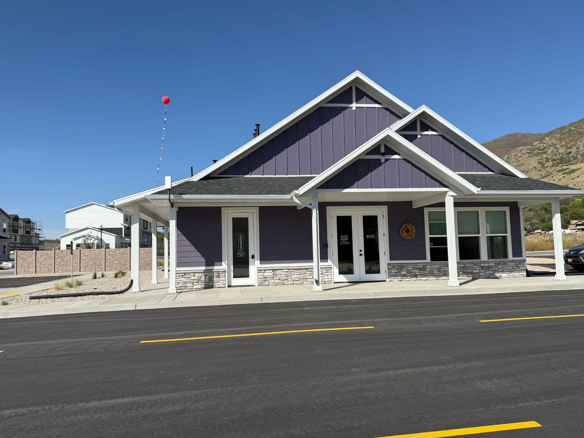 Spring Creek RV Resort office and laundry building with the Wasatch mountains behind, Farmington Utah