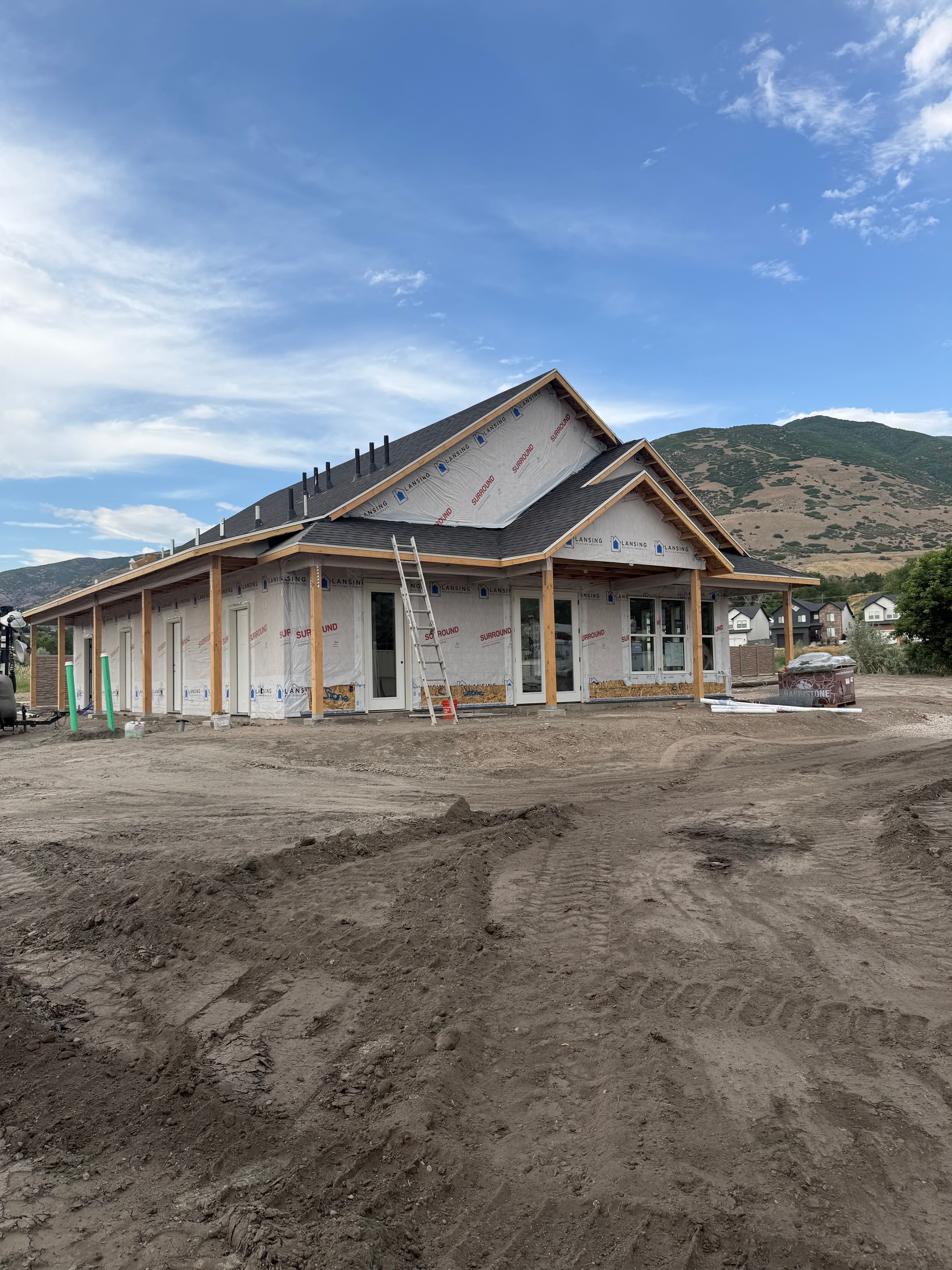 Spring Creek RV Resort clubhouse under construction with Wasatch mountain views, Farmington Utah