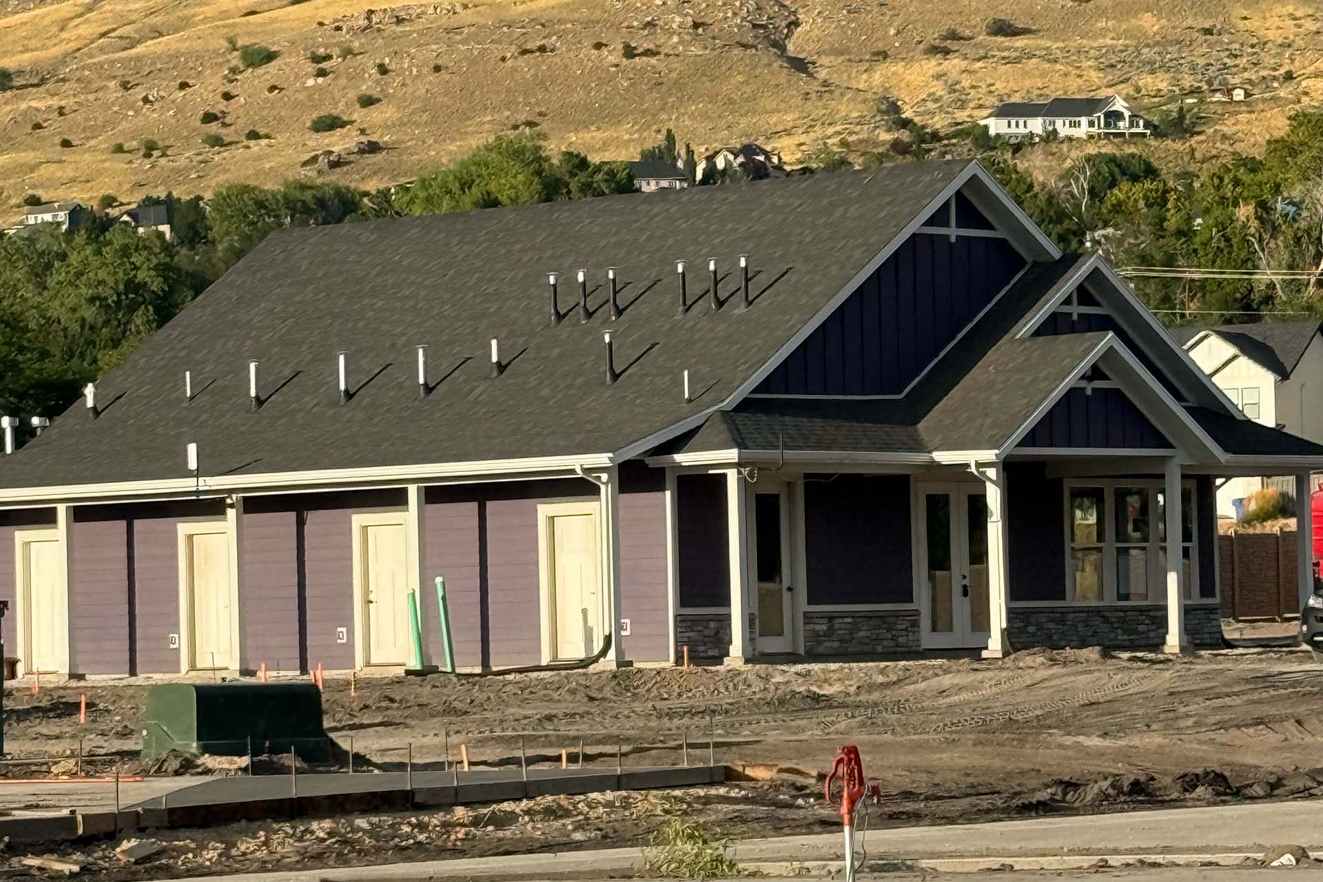 Spring Creek RV Resort clubhouse under construction with Wasatch mountain views, Farmington Utah