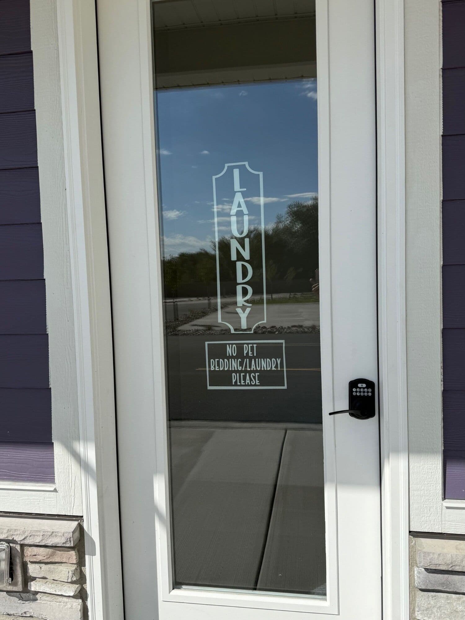 Laundry room entrance with keypad lock